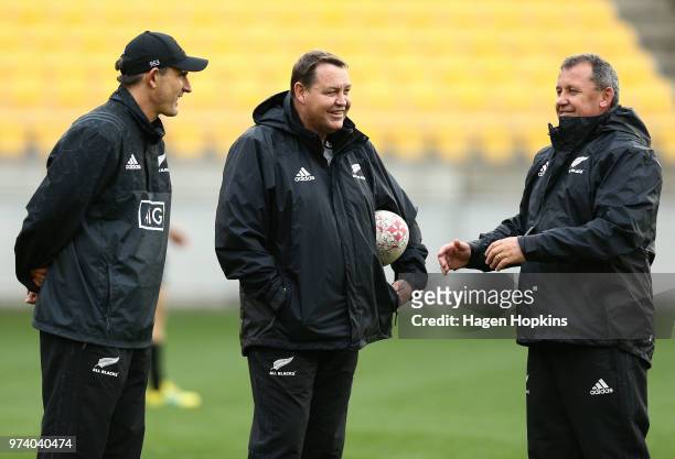 Coach Steve Hansen and assistant coaches Scott McLeod and Ian Foster talk during a New Zealand All Blacks training session at Westpac Stadium on June...