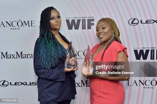 Honorees Denisia 'Blu June' Andrews and Brittany "Chi" Coney of NOVA Wav pose with The Women In Film Artistic Excellence Award during the Women In...