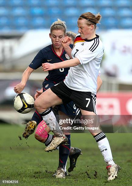 Melanie Behringer of Germany and Amy Rodriguez of USA battle for the ball during the Women Algarve Cup match between Germany and USA on March 3, 2010...