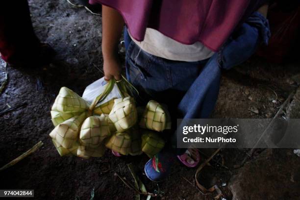 Peoples fulfilled the traditional market as they shopping for preparation of Eid al Fitr at Pamor traditional market, Cibitung, Bekasi regency, West...