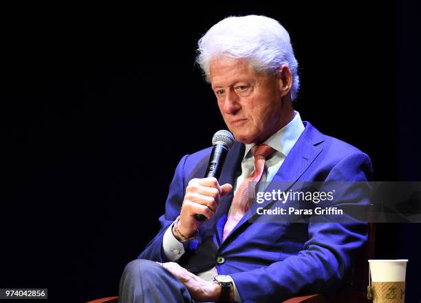 Former President of the United States Bill Clinton speaks on stage during a discussion of his new book 'The President Is Missing' at Cobb Energy...