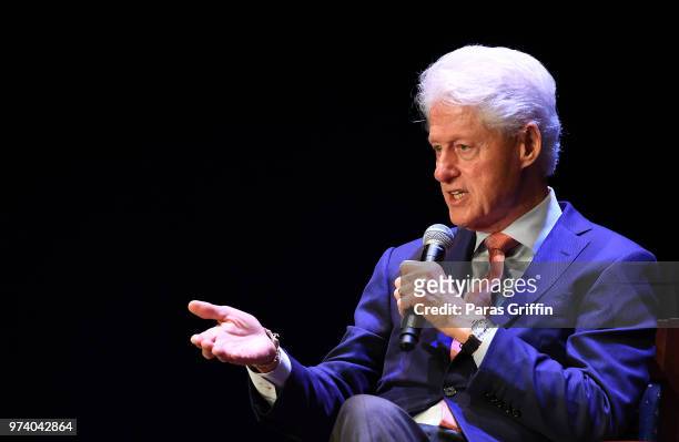 Former President of the United States Bill Clinton speaks on stage during a discussion of his new book 'The President Is Missing' at Cobb Energy...