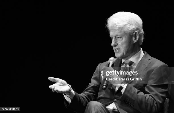 Former President of the United States Bill Clinton speaks on stage during a discussion of his new book 'The President Is Missing' at Cobb Energy...