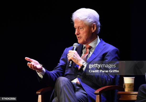 Former President of the United States Bill Clinton speaks on stage during a discussion of his new book 'The President Is Missing' at Cobb Energy...