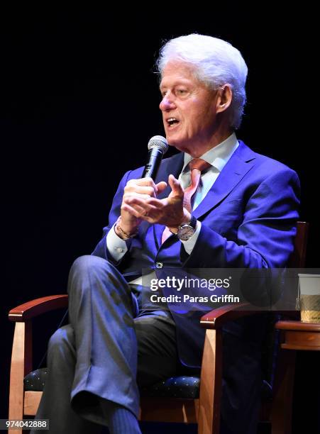 Former President of the United States Bill Clinton speaks on stage during a discussion of his new book 'The President Is Missing' at Cobb Energy...