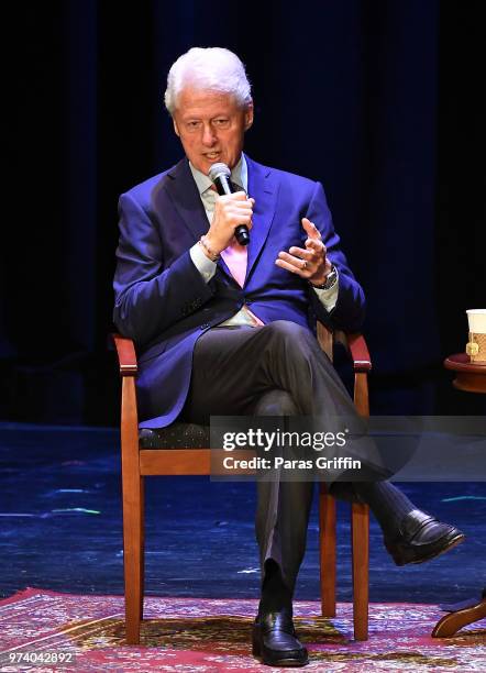 Former President of the United States Bill Clinton speaks on stage during a discussion of his new book 'The President Is Missing' at Cobb Energy...