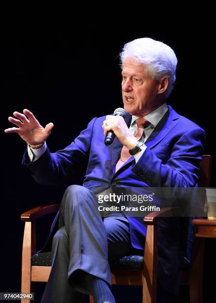 Former President of the United States Bill Clinton speaks on stage during a discussion of his new book 'The President Is Missing' at Cobb Energy...