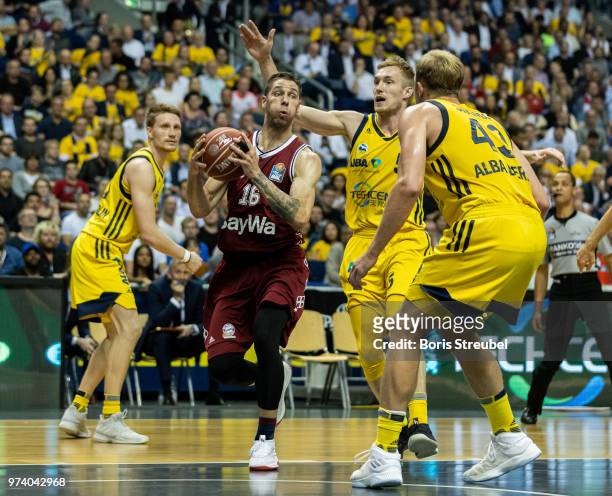 Stefan Jovic of Bayern Muenchen competes with Niels Giffey of ALBA Berlin during the fourth play-off game of the German Basketball Bundesliga finals...