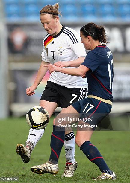 Melanie Behringer of Germany and Meghan Rapinoe of USA battle for the ball during the Women Algarve Cup match between Germany and USA on March 3,...