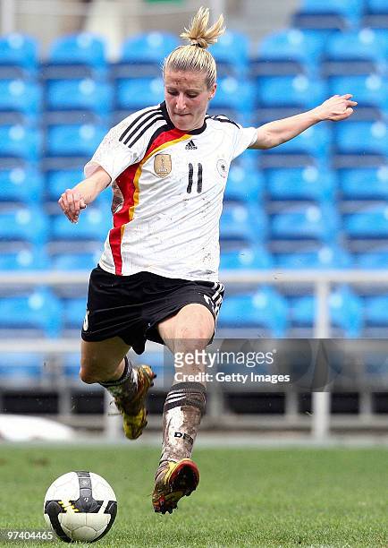 Anja Mittag of Germany runs with the ball during the Women Algarve Cup match between Germany and USA on March 3, 2010 in Faro, Portugal.