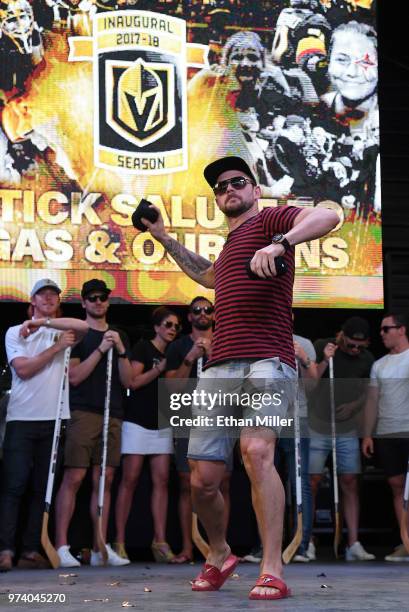 Tomas Tatar of the Vegas Golden Knights throws T-shirts to the crowd as he is introduced at the team's "Stick Salute to Vegas and Our Fans" event at...