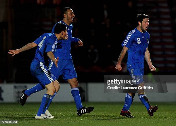 Ioannis Papadopoulos of Greece celebrates scoring the second goal during the UEFA Under 21 Championship Qualifying match between England and Greece...