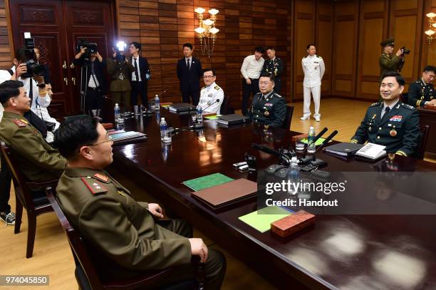 In this handout image provided by South Korean Defense Ministry, South Korean Major. Gen. Kim Do-gyun talks with his North Korean counterpart Lt....