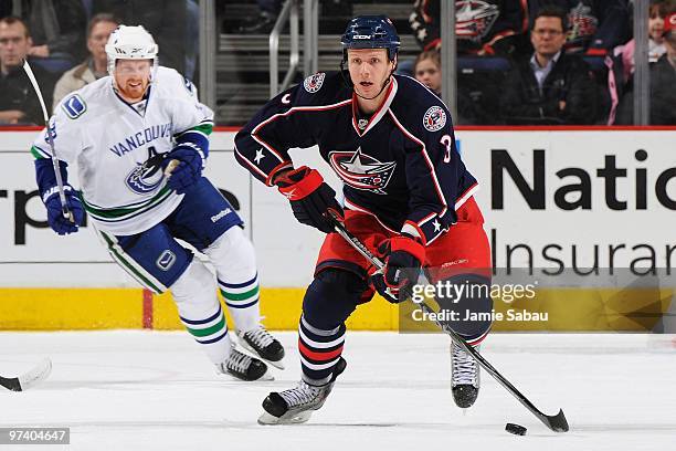 Defenseman Marc Methot of the Columbus Blue Jackets skates with the puck against the Vancouver Canucks on March 2, 2010 at Nationwide Arena in...