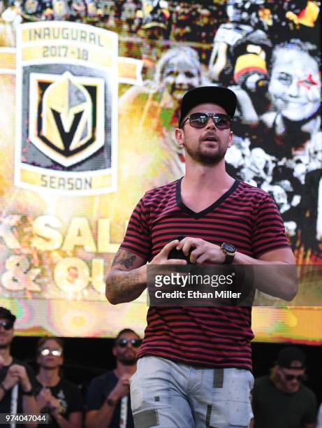 Tomas Tatar of the Vegas Golden Knights throws T-shirts to the crowd as he is introduced at the team's "Stick Salute to Vegas and Our Fans" event at...