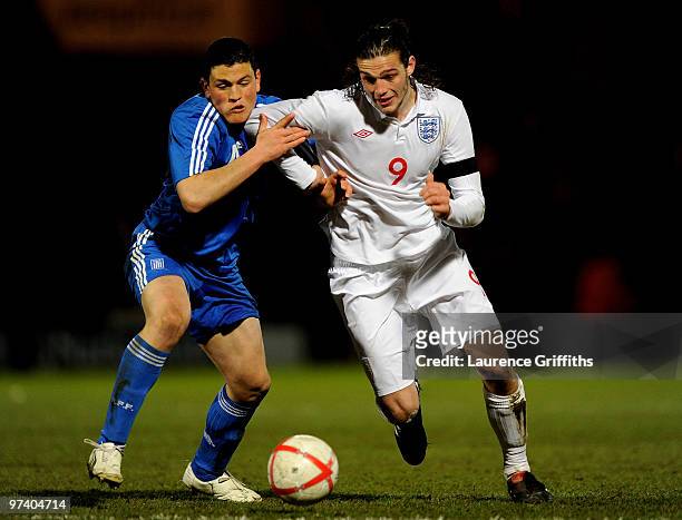 Andy Carroll of England battles for the ball with Kyriakos Papadopoulos of Greece during the UEFA Under 21 Championship Qualifying match between...
