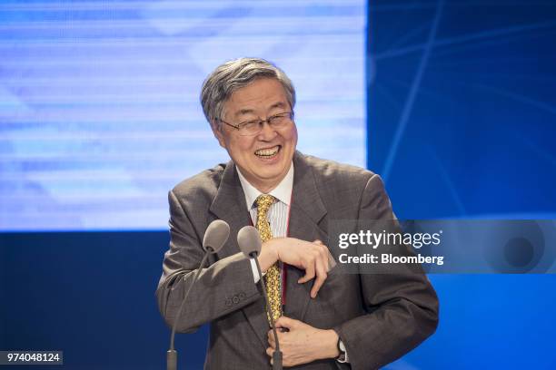 Zhou Xiaochuan, former governor of the People's Bank of China , reacts during the Lujiazui Forum in Shanghai, China, on Thursday, June 14, 2018....