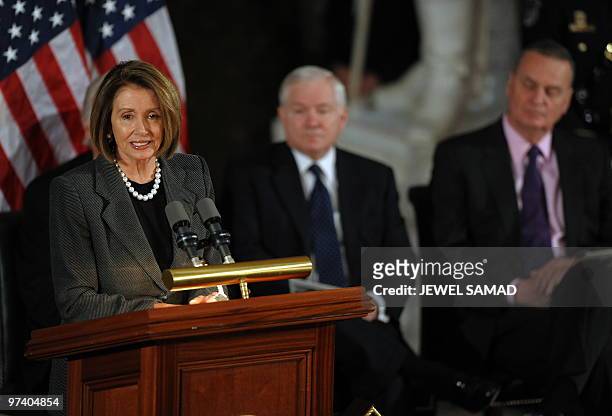 House Speaker Nancy Pelosi speaks as US Defense Secretary Robert Gates and National Security Adviser James Jones look on during a memorial service...