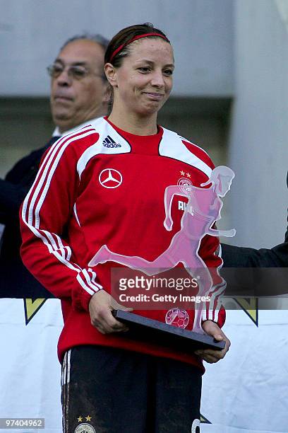 Inka Grings of Germany poses with the second price after the Women Algarve Cup final match between Germany and USA on March 3, 2010 in Faro, Portugal.
