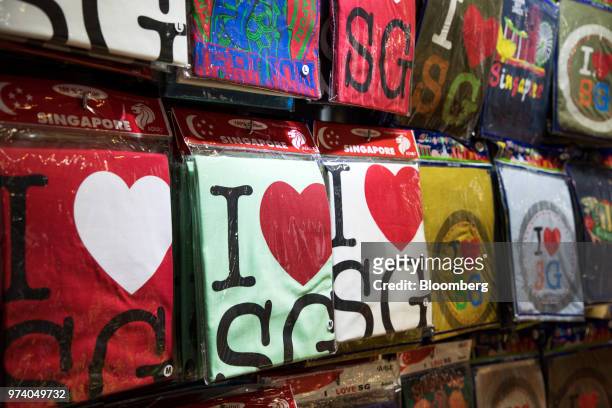 Shirts are displayed for sale at a stall in the Chinatown area of Singapore, on Wednesday, June 13, 2018. Tourism as well as the consumer sector will...