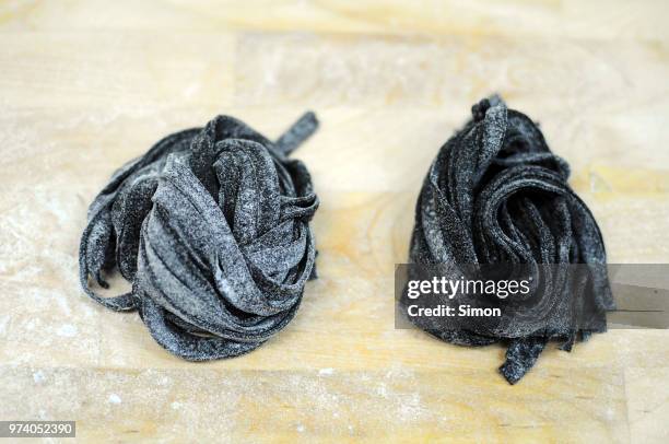 squid ink pasta - squid ink pasta stock pictures, royalty-free photos & images