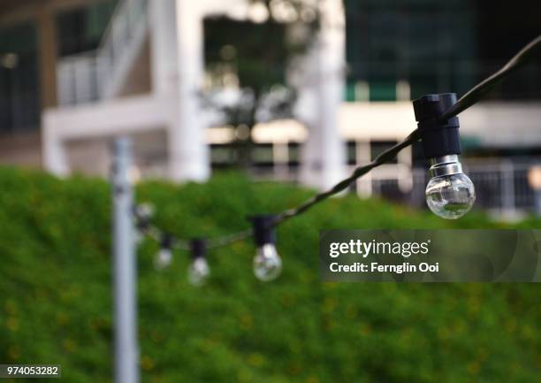 light bulbs on cord, subang jaya, selangor, malaysia - subang stock pictures, royalty-free photos & images