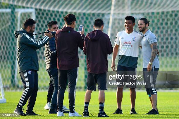 Jesus Gallardo of Mexico and singer Maluma pose for pictures during a training session at FC Strogino Stadium on June 12, 2018 in Moscow, Russia.