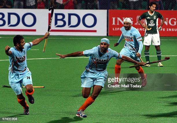 Indian players Sandeep Singh, Deepak Thakur and Prabjot Singh celebrate the victory against Pakistan at the Hockey World Cup in New Delhi on February...