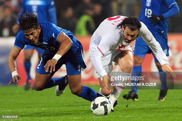 Honduras' Carlo Costly fights for the ball with Turkey's Servet Cetin during their friendly soccer match at Inonu stadium in Istanbul, on March 3,...