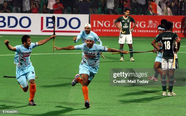 Indian players Sandeep Singh, Deepak Thakur and Prabjot Singh celebrate the victory against Pakistan at the Hockey World Cup in New Delhi on February...