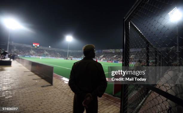 Security personnel can be seen at guard at the Dhyan Chand Nation Hockey Stadium during the pool B match of India against Pakistan at the Hockey...