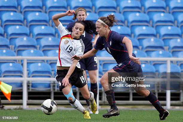 Fatmire Bajramaj of Germany and Lauren Cheney of USA battle for the ball during the Women Algarve Cup match between Germany and USA on March 3, 2010...