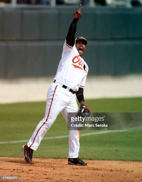 Third baseman Miguel Tejada of the Baltimore Orioles calls a play against the Tampa Bay Rays at Ed Smith Stadium on March 3, 2010 in Sarasota,...