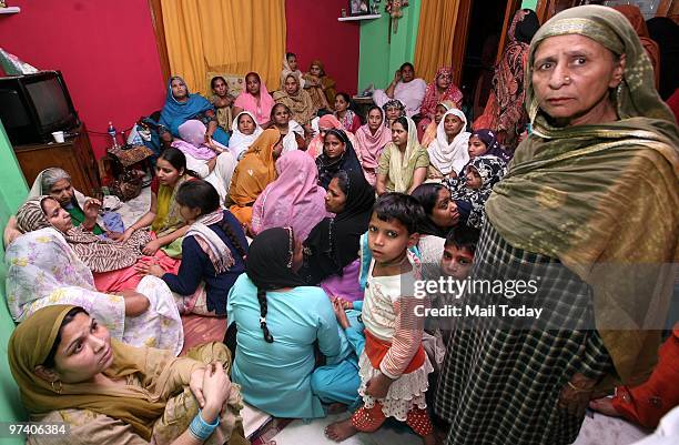 Family members of Tabla Player Nawab Khan who died in Kabul attack at his residance in New Delhi on February 27, 2010.