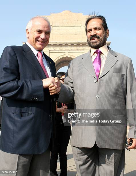 Indian Olympic Association President Suresh Kalmadi and Hockey Association President Leandra Negre during a photo shoot in front of India Gate in New...