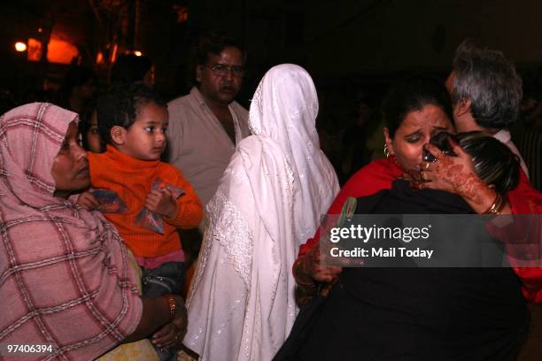 Family members of Tabla Player Nawab Khan who died in Kabul attack at his residance in New Delhi on February 27, 2010.