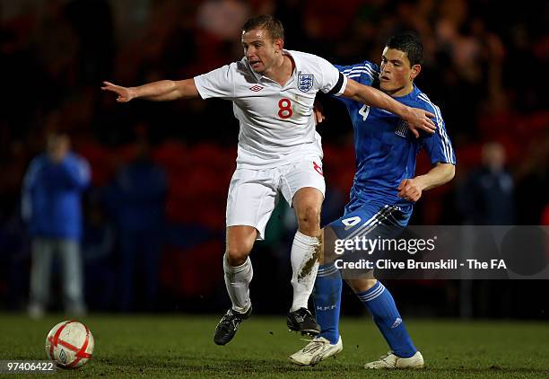 Lee Cattermole of England attempts to hold off Kyriakos Papadopoulos of Greece during the U-21 Group 9 European Championship Qualifying Match between...