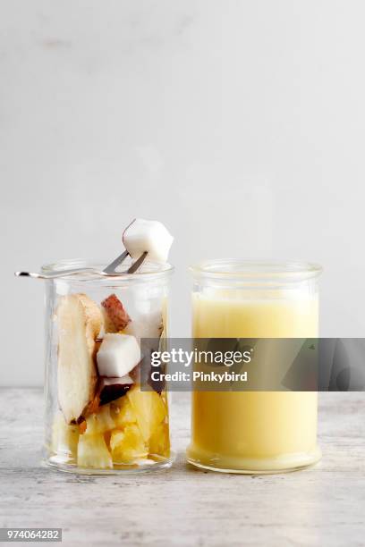 coconut smoothie - yellow smoothie stock pictures, royalty-free photos & images