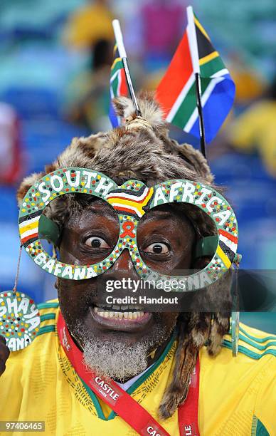 In this handout image provided by the 2010 FIFA World Cup Organising Committee for South Africa,, South African fans attend the International...