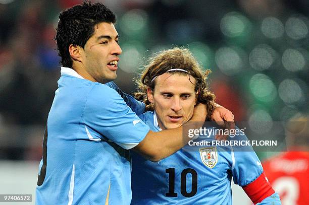 Uruguay's Luis Suarez and Diego Forlan jubilate after scoring during the World Cup 2010 friendly football match Switzerland vs Uruguay at AFG Arena...