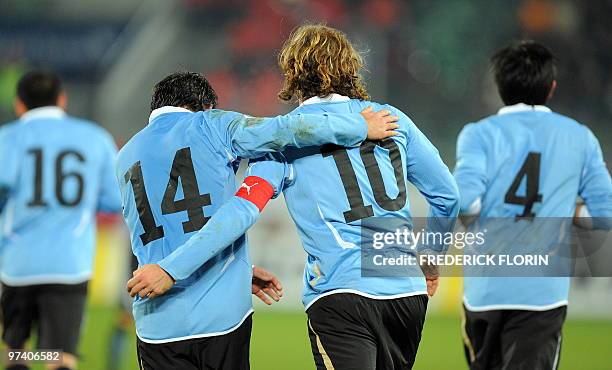 Uruguay's players jubilate after scoring during the World Cup 2010 friendly football match Switzerland vs Uruguay at AFG Arena stadium on March 3,...