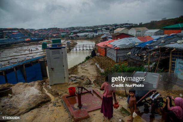 People walks inside the Kutupalong makeshift shelter in Coxs Bazar, Bangladesh on June 13, 2018. Around one million Rohingya Refugees has taken...