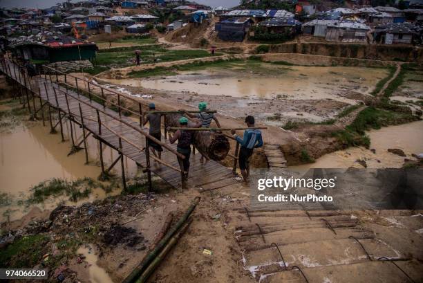 People walks inside the Kutupalong makeshift shelter in Coxs Bazar, Bangladesh on June 13, 2018. Around one million Rohingya Refugees has taken...