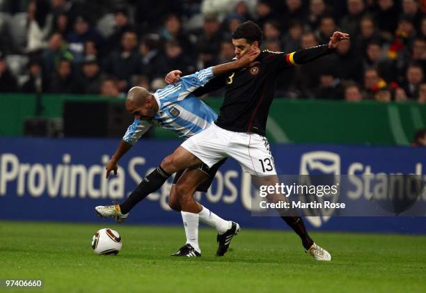 Michael Ballack of Germany and Juan Veron of Argentina compete for the ball during the International Friendly match between Germany and Argentina at...