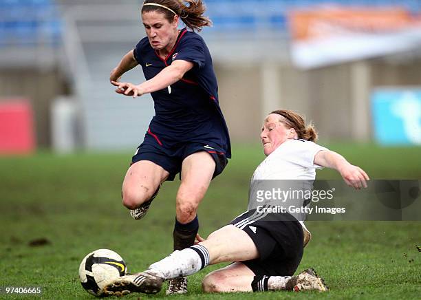 Melanie Behringer of Germany and Heather O'Reilly of USA battle for the ball during the Women Algarve Cup match between Germany and USA on March 3,...