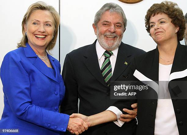 Secretary of State Hillary Rodham Clinton shakes hands with Dilma Roussef Brazil's chief of Staff as Brazilian President Luiz Inacio Lula da Silva...