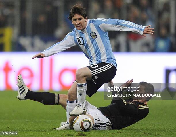 Argentina's forward Lionel Messi and Germany's midfielder Bastian Schweinsteiger vie for the ball during the friendly football match Germany vs...