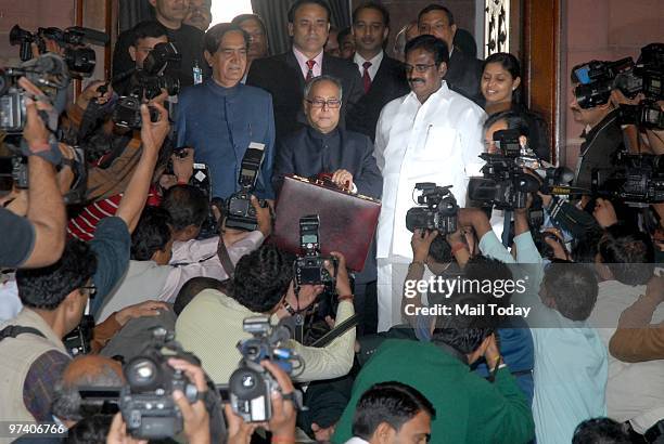 Union Finance Minister Pranab Mukherjee along with his team posing for a photo before leaving for Parliament to present the Annual Budget 2010-2011,...