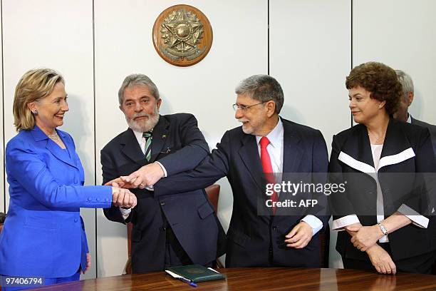 Secretary of State Hillary Rodham Clinton, Brazil's President Luiz Inacio Lula da Silva and his Foreign Affairs minister Celso Amorim and Dilma...