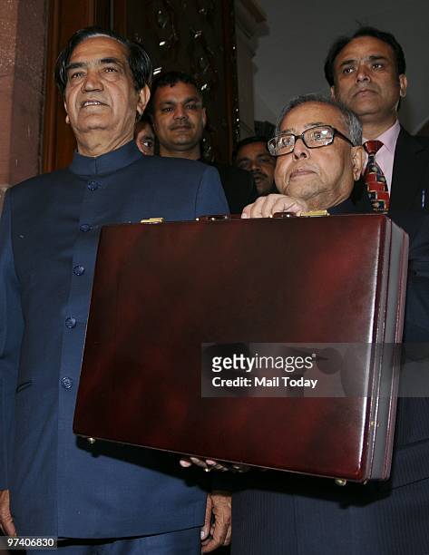 Union Finance Minister Pranab Mukherjee along with his team posing for a photo before leaving for Parliament to present the Annual Budget 2010-2011,...